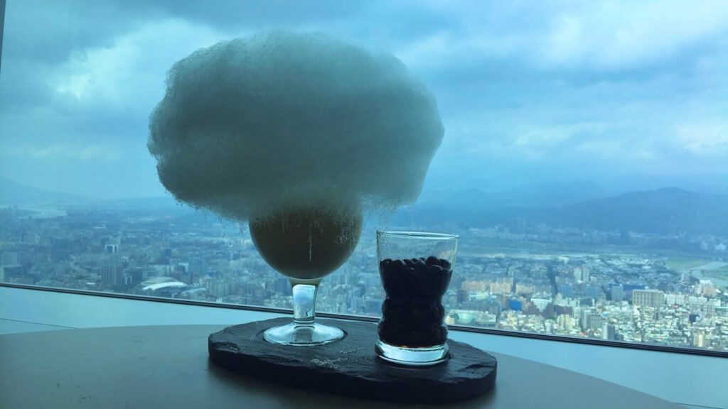 bubble tea with a "cloud" above it (aka cotton candy) get this at the coffee shop in Taipei 101